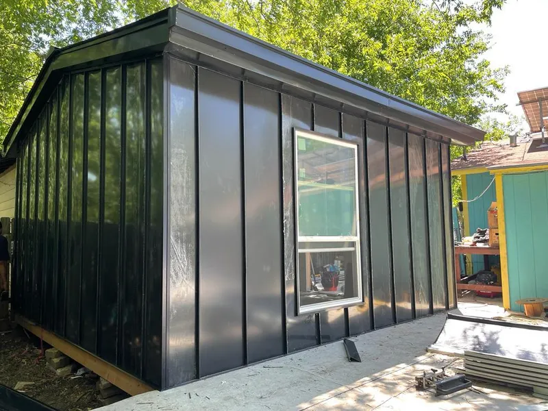 Black standing seam metal wall panels for Roof Inspection in Dardenne Prairie