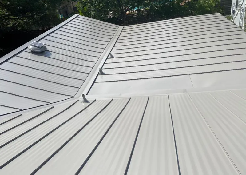 Solar attic fan installed on a metal roof for Roof Ventilation in Dardenne Prairie